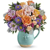 The Busy Bee Pitcher - Premium. An arrangement by Flowers of Jacksonville.