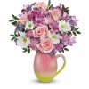 Teleflora's Spring Pitcher - Deluxe. An arrangement by Sueppel's Flowers.