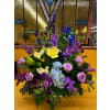 Mixed Purple Funeral Basket - Standard. An arrangement by Sun Valley Florist.