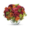 A testy mix of Hot Pink and Orange - Deluxe. An arrangement by Flowers and Beyond.