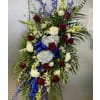 Red, White, and Blue Tribute Standing Spray - Deluxe. An arrangement by Bourbon Babes Bouquet and Boutique.