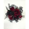 Red Rose Wrist Corsage - Deluxe. An arrangement by Petal Pushers Flower and Gift Shop.