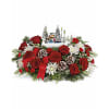 TF Thomas Kinkade's 2024 Skate into the Holidays - Premium. An arrangement by Nicol Florist.