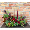 By Design Holiday Centerpiece - Deluxe. An arrangement by Flowers By Design.