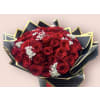 Red Ramo Buchon - Standard. An arrangement by Charming Blooms.