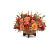 Modern Copper Centerpiece - Premium. An arrangement by Sueppel's Flowers.