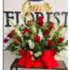 Scarlet and Ivory Embrace - Premium. An arrangement by Geni's Florist and Gifts.