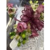 Winter Whispers Corsage - Deluxe. An arrangement by Lily Pad Florist.