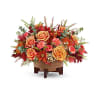 Teleflora's Modern Copper Centerpiece - Premium. An arrangement by Michael's Flowers.