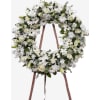 Pure Grace Wreath - Deluxe. An arrangement by Geni's Florist and Gifts.