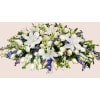 Heavenly Grace Casket Spray - Standard. An arrangement by Geni's Florist and Gifts.
