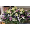Garden Serenity Casket Spray - Deluxe. An arrangement by Tom's Florist.
