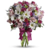 Daisy Kisses and Rose Wishes - Premium. An arrangement by Leland Florist.