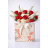 Romance to Go - Premium. An arrangement by Geni's Florist and Gifts.