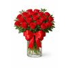 Devoted to Love - Deluxe. An arrangement by Geni's Florist and Gifts.
