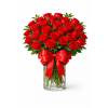 Devoted to Love - Premium. An arrangement by Geni's Florist and Gifts.