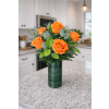DELUXE ORANGE ROSES - Standard. An arrangement by Petals and Co..