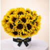 Sunshine in a Box - Standard. An arrangement by Geni's Florist and Gifts.