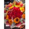 Golden Glow Romance - Premium. An arrangement by Geni's Florist and Gifts.