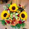 Warmth and Whimsy - Deluxe. An arrangement by Avenue Florist.