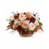 Teleflora's Sunset Stone Centerpiece - Standard. An arrangement by Marivel's Florist and Gifts.