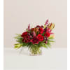 Crimson Carol™ - Deluxe. An arrangement by Flowers of Jacksonville.