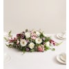 Romantic Blush™ Centerpiece - Deluxe. An arrangement by Sicola's Florist.
