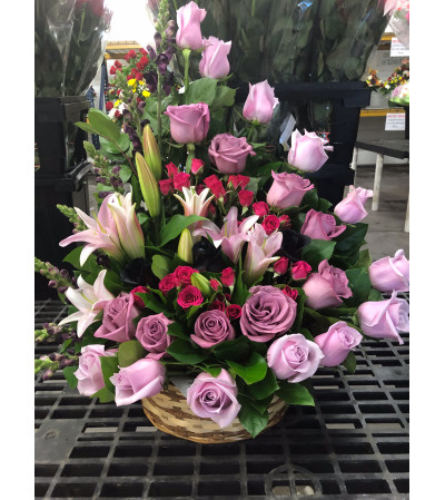 A Sympathy Basket with Shades of Purple Roses A Sympathy Basket with Shades of Purple Roses