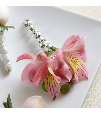 The FTD® Pink Peruvian Lily Boutonniere The FTD® Pink Peruvian Lily Boutonniere