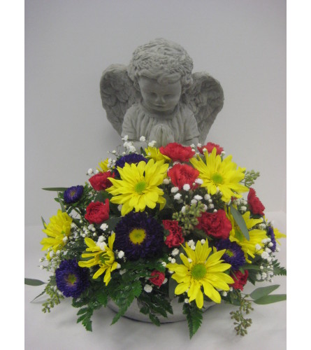 Sympathy angel with an arrangement in the bowl