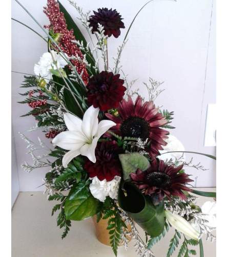 Burgundy Delight. An arrangement by Flowers Plus.
