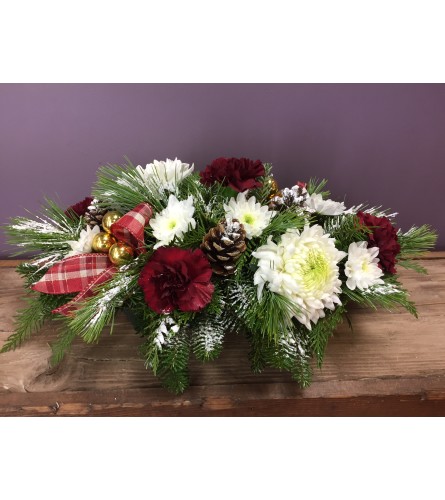 Holiday. An arrangement by The Flower Shop in the Village.