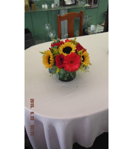 sun flowers and red gerber daisies,  red roses and solidiego