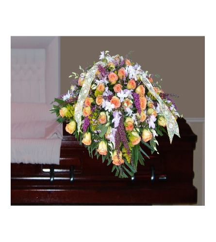 CASKET OF YELLOW ROSES, ORCHIDS, AND MIXED FILLERS