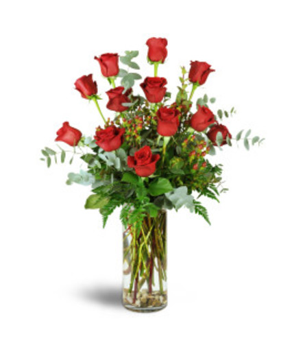 12 RED ROSES ARRANGED WITH ASSORTED FOLIAGE IN A VASE