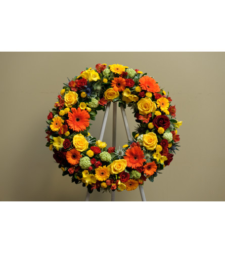 Standing Wreath with Spray Roses Gerbera. An arrangement by Enchanted Florist.