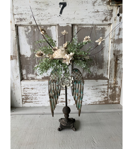 Angel Wing Stand with Orchid. An arrangement by Metcalfe Florist and Pleasant View Greenhouses.