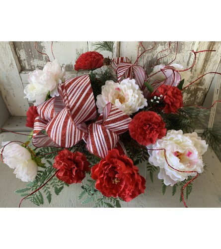 Candy Cane Ribbon Saddle. An arrangement by Metcalfe Florist and Pleasant View Greenhouses.