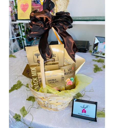 Gourmet Snacker Gift Basket. An arrangement by Sonia's Florist.