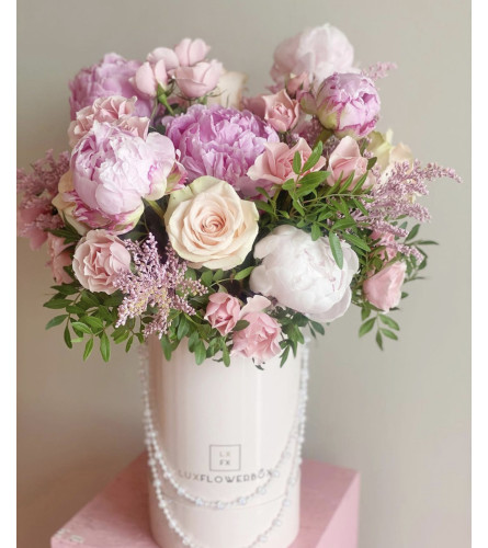 Peonies with roses. An arrangement by Lux Flower Box.