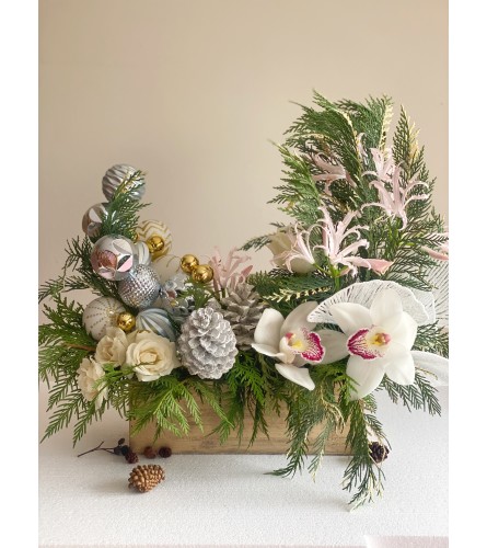 Christmas centerpiece with Orchids. An arrangement by Lux Flower Box.