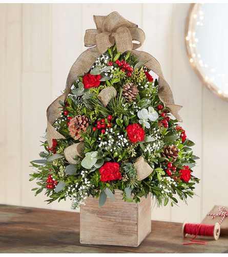 CABIN TREE. An arrangement by J.D. Ballantine's Flowers and Gifts.