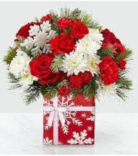Snowflake Surprise - Deluxe. An arrangement by Novak's Flower Shoppe.