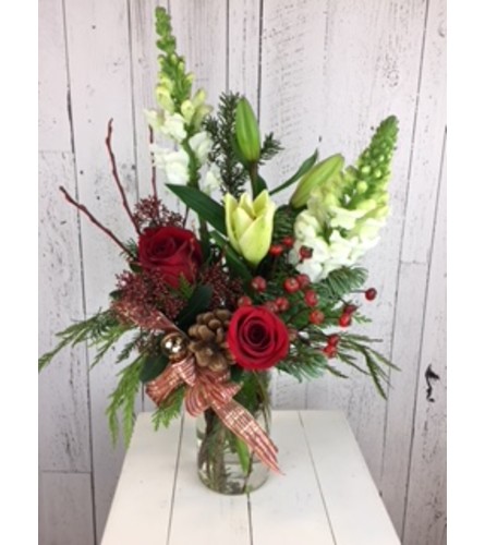 Christmas Awakening Arrangement. An arrangement by Avenida Flowers.