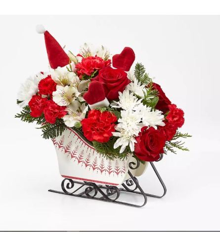 WHITE SNOW SLEIGH - Deluxe. An arrangement by Geni's Florist and Gifts.