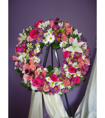 Pastel Peace Wreath. An arrangement by Always in Bloom Flower Shop.