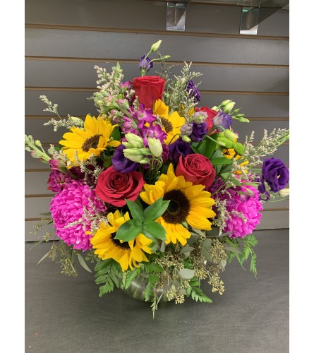 Wine and flowers. An arrangement by DMP Flowers and Gifts.
