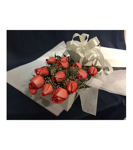 Dozen Orange Roses Boxed. An arrangement by Wasaga Flowers.