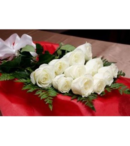 12 White Roses Boxed. An arrangement by Flowers and Pine World.