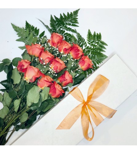 Dozen Boxed Orange Roses. An arrangement by Chahna Fai and Church Street Flowers.